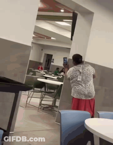 Woman Taking Photo Of Child In Restaurant GIF
