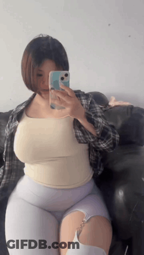 Woman Taking Picture Of Herself In Mirror GIF