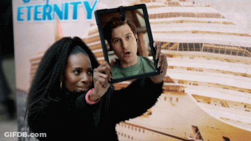 Woman Taking Picture Of Man In Front Of Eternity Sign GIF