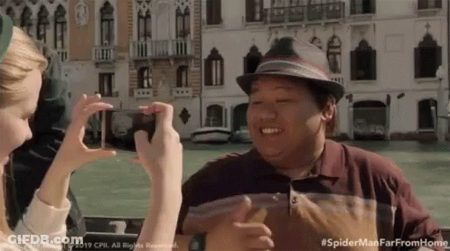 Woman Taking Picture Of Man In Hat #Spidermanfarfromhome GIF