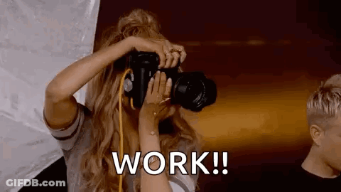 Woman Taking Picture With Work Text GIF