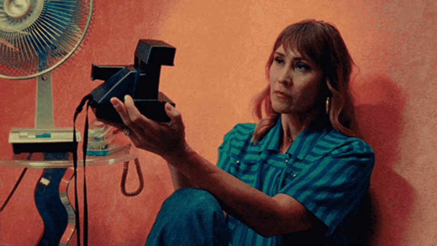 Woman Taking Polaroid Selfie GIF
