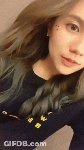 Woman Taking Selfie In Black Shirt With Letter W GIF