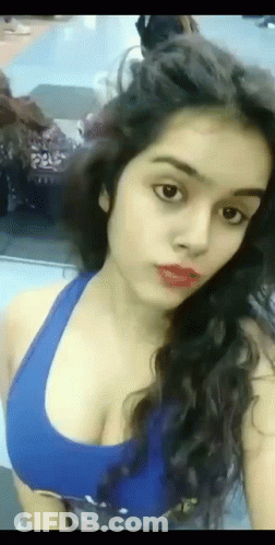 Woman Taking Selfie In Blue Tank Top GIF