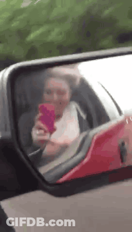 Woman Taking Selfie In Car Mirror GIF