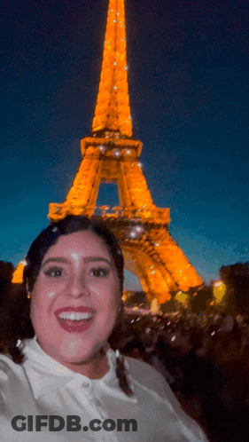Woman Taking Selfie In Front Of Eiffel Tower GIF