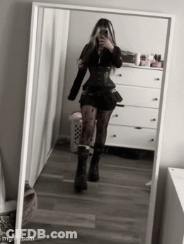 Woman Taking Selfie In Front Of Mirror In Bedroom GIF