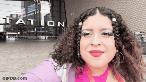 Woman Taking Selfie In Front Of Station GIF