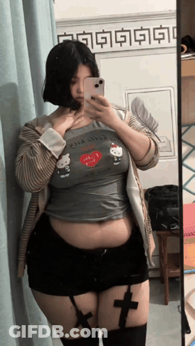 Woman Taking Selfie In Hello Kitty Shirt GIF