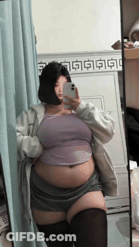 Woman Taking Selfie In Mirror GIF