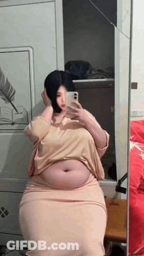 Woman Taking Selfie In Mirror GIF