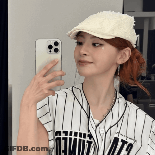 Woman Taking Selfie In Mirror Wearing Ota Jersey GIF