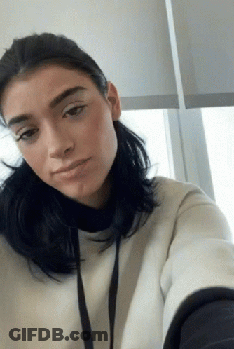Woman Taking Selfie In White Sweatshirt GIF