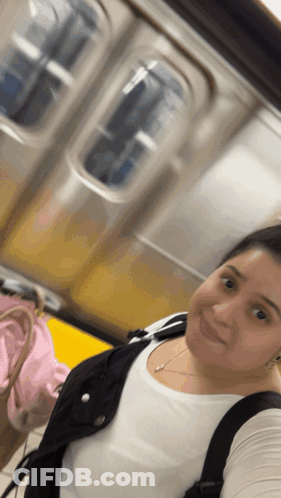 Woman Taking Selfie On Subway GIF