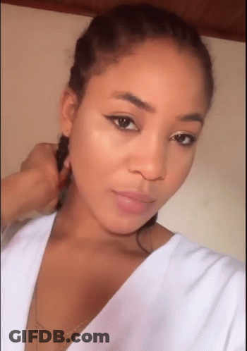 Woman Taking Selfie With Braided Hair GIF