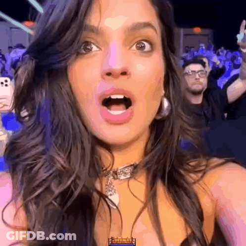 Woman Taking Selfie With Open Mouth And Crowd GIF