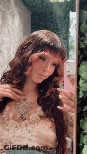 Woman Taking Selfie With Pink Phone GIF