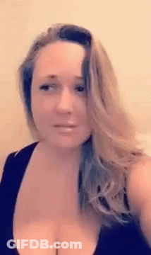 Woman Taking Selfie With Visible Breasts In Black Tank Top GIF