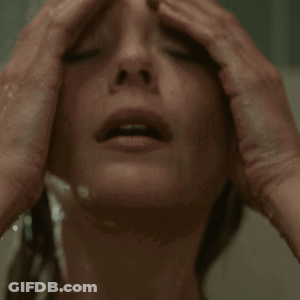 Woman Taking Shower With Eyes Closed GIF