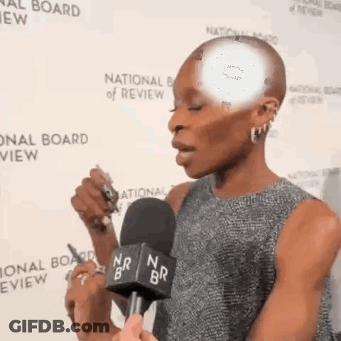 Woman Talking Into Microphone At National Board Of Review GIF