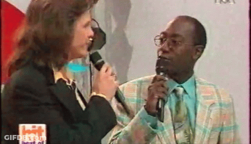 Woman Talking Into Microphone GIF