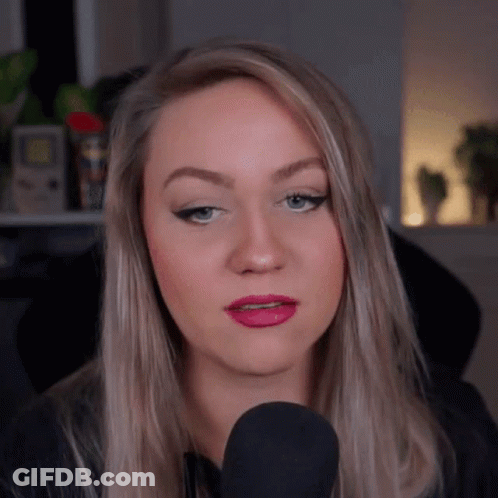 Woman Talking Into Microphone Making Face GIF