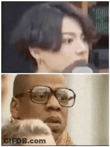 Woman Talking Into Microphone Man Pointing GIF