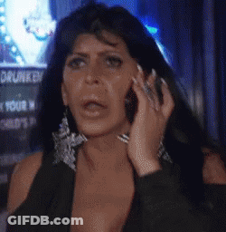 Woman Talking On Cell Phone In Front Of Drunk Sign GIF
