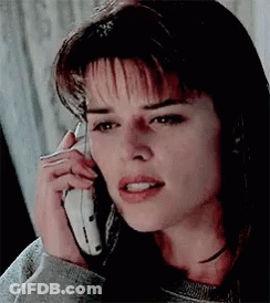 Woman Talking On Cell Phone Making Funny Face GIF