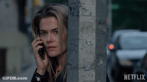 Woman Talking On Cell Phone Next To Answer Sign GIF