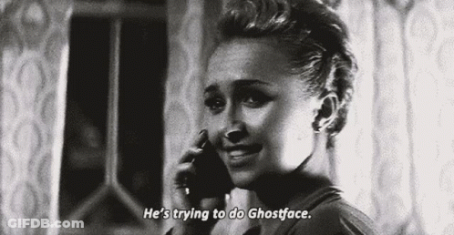 Woman Talking On Cell Phone Saying He's Trying To Do Ghostface GIF