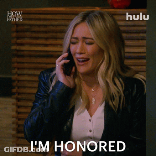 Woman Talking On Cell Phone Saying I'm Honored GIF