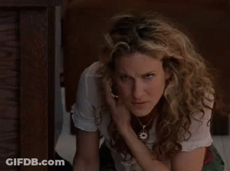 Woman Talking On Cell Phone While Kneeling GIF