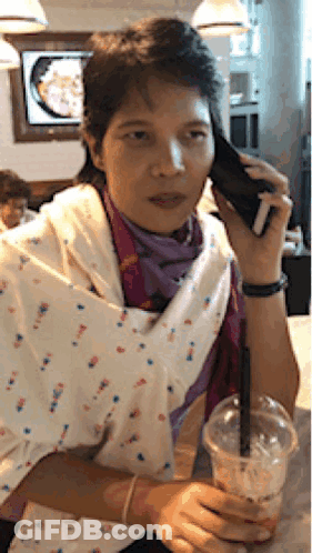 Woman Talking On Cell Phone With Coffee GIF