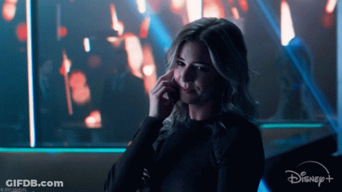 Woman Talking On Cell Phone With Disney Plus Logo GIF