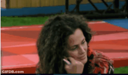 Woman Talking On Cell Phone With Hand On Face GIF