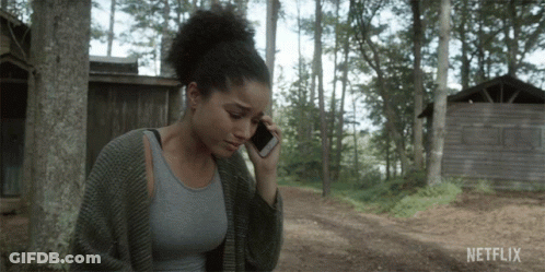 Woman Talking On Cell Phone With Netflix GIF