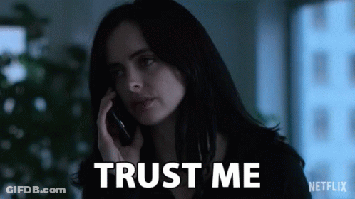 Woman Talking On Cell Phone With Trust Me Behind Her GIF