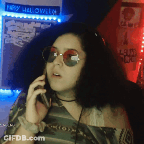 Woman Talking On Phone Halloween Sign GIF