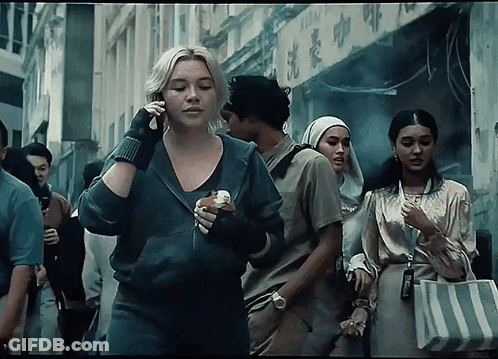 Woman Talking On Phone Holding Sandwich GIF