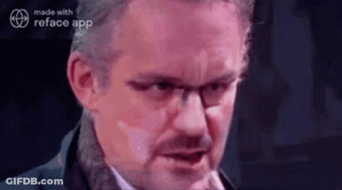 Woman Talking On Phone Looking In Mirror GIF