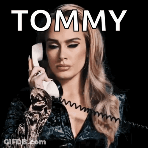 Woman Talking On Phone With Tommy Above GIF