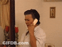 Woman Talking On Telephone In Living Room GIF