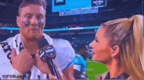 Woman Talking To Football Player On TV GIF