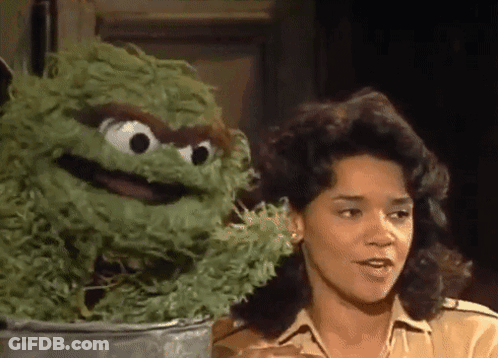 Woman Talking To Green Sesame Street Character GIF