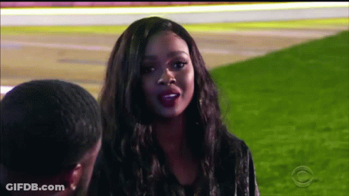 Woman Talking To Man In Field GIF