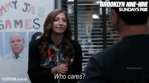 Woman Talking To Man In Front Of Games Sign GIF