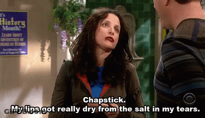 Woman Talking To Man In Front Of History Month Sign GIF