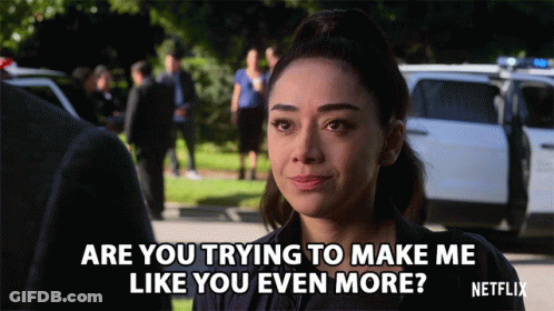 Woman Talking To Man In Front Of Police Car Says Are You Trying To Make Me Like You Even More GIF