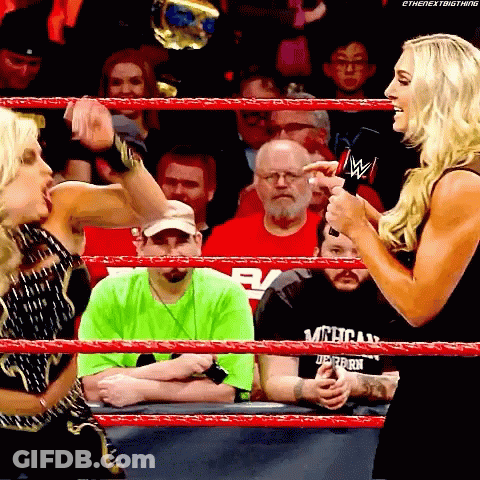 Woman Talking To Man In Michigan Shirt GIF
